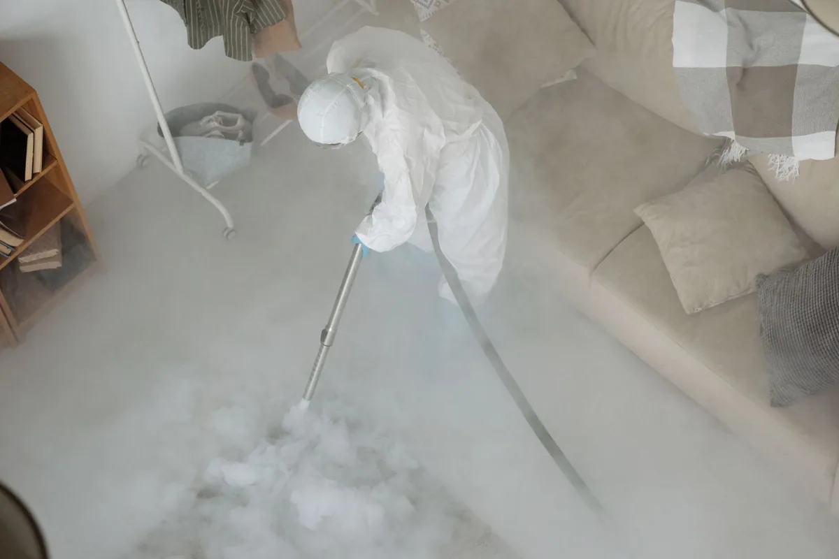 Biohazard cleanup technician in protective equipment, Kittery, ME